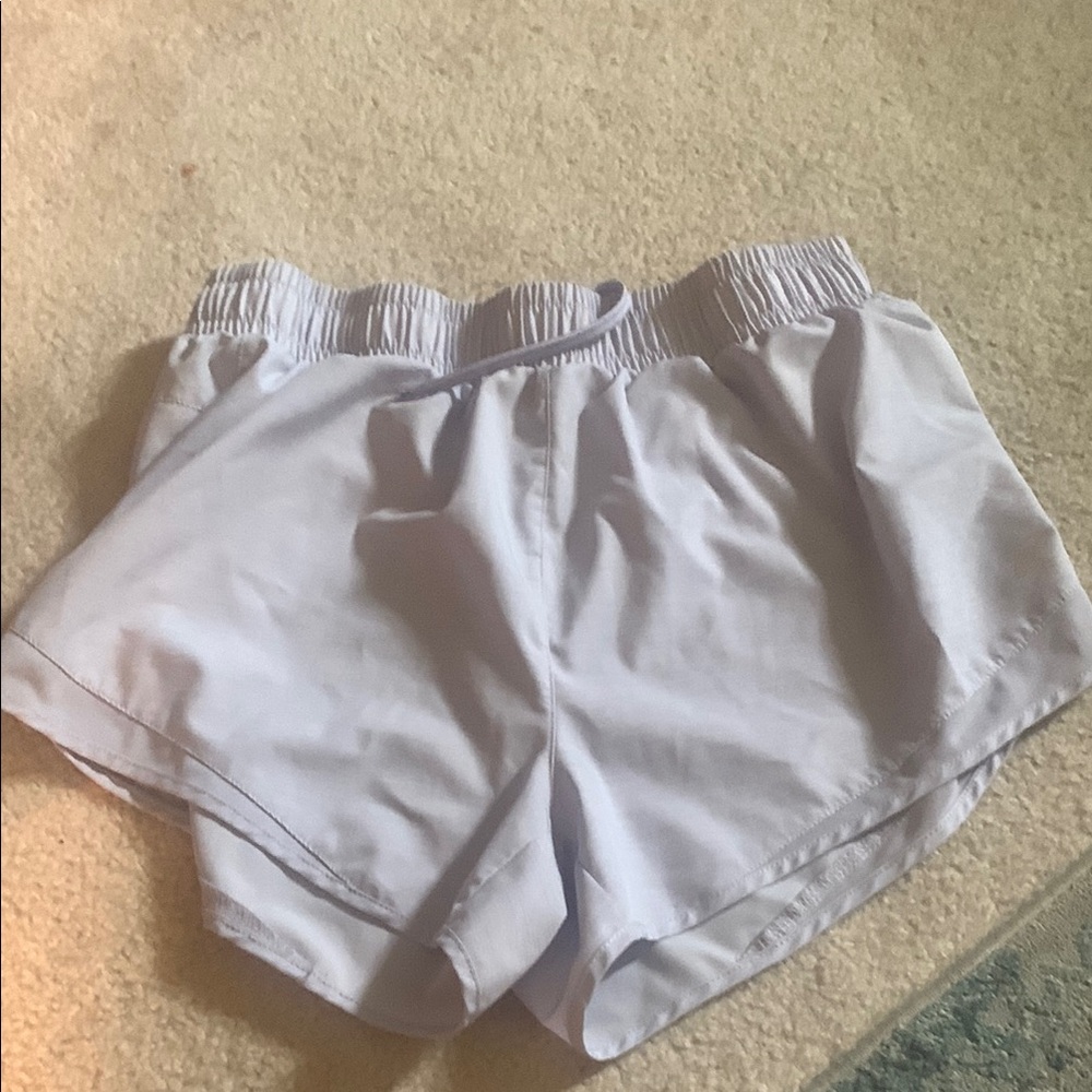 light purple asics unlined shorts